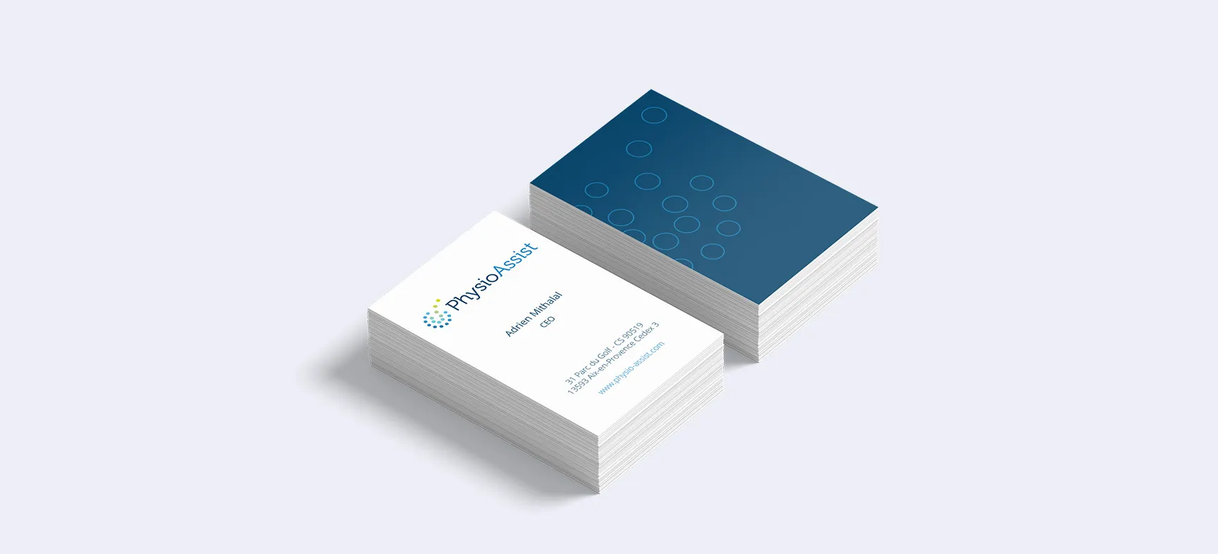 Mockup of professional business cards printed for the PhysioAssist brand